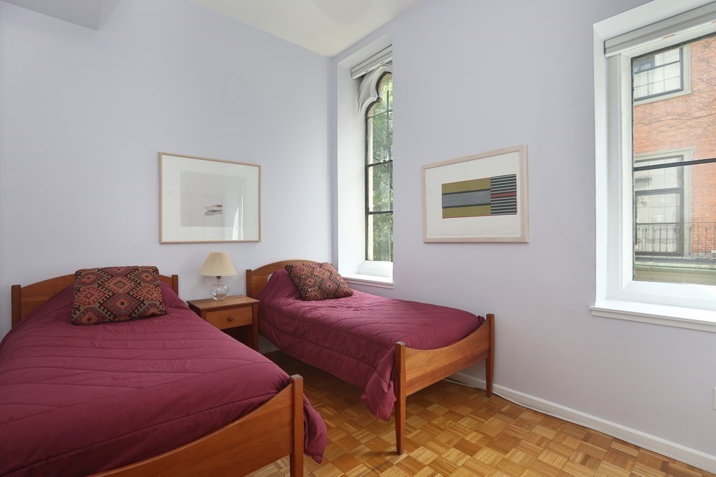 27 Chestnut Street, Unit 1B Boston, MA 02108 - Photo 11 of 14 a bedroom with two beds and a window
