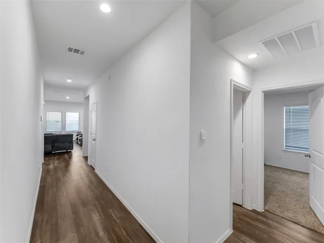 a bedroom with a bed and a view of bedroom