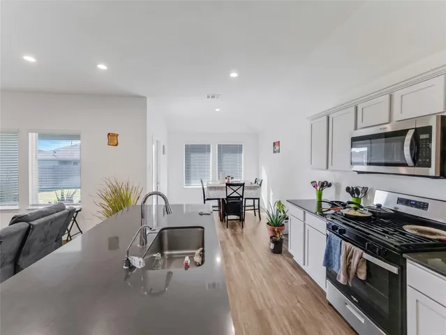 a bed sitting in a room next to a window