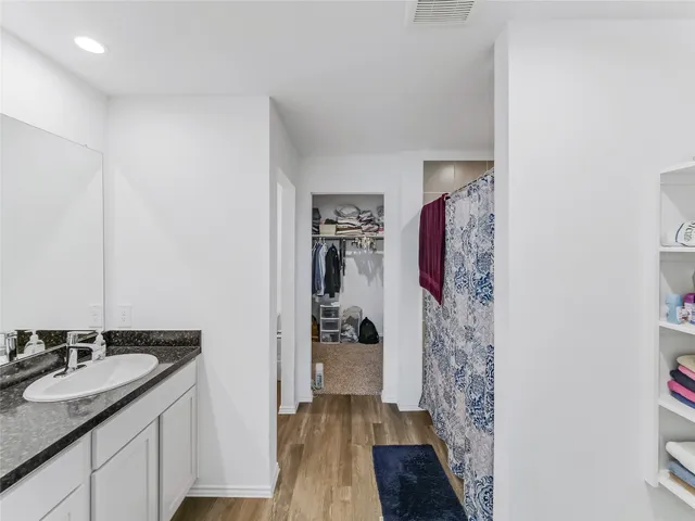 a view of a house with backyard and porch