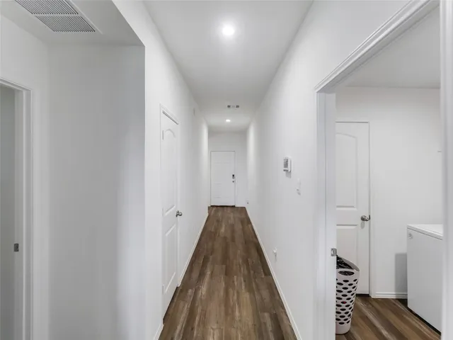 a view of hallway with washer and dryer