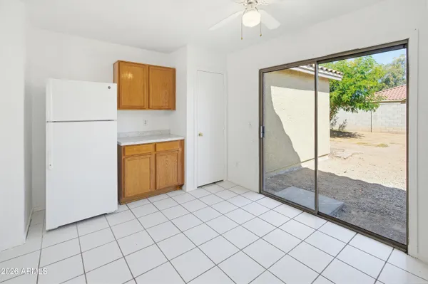a view of a room that has a bed and a large window