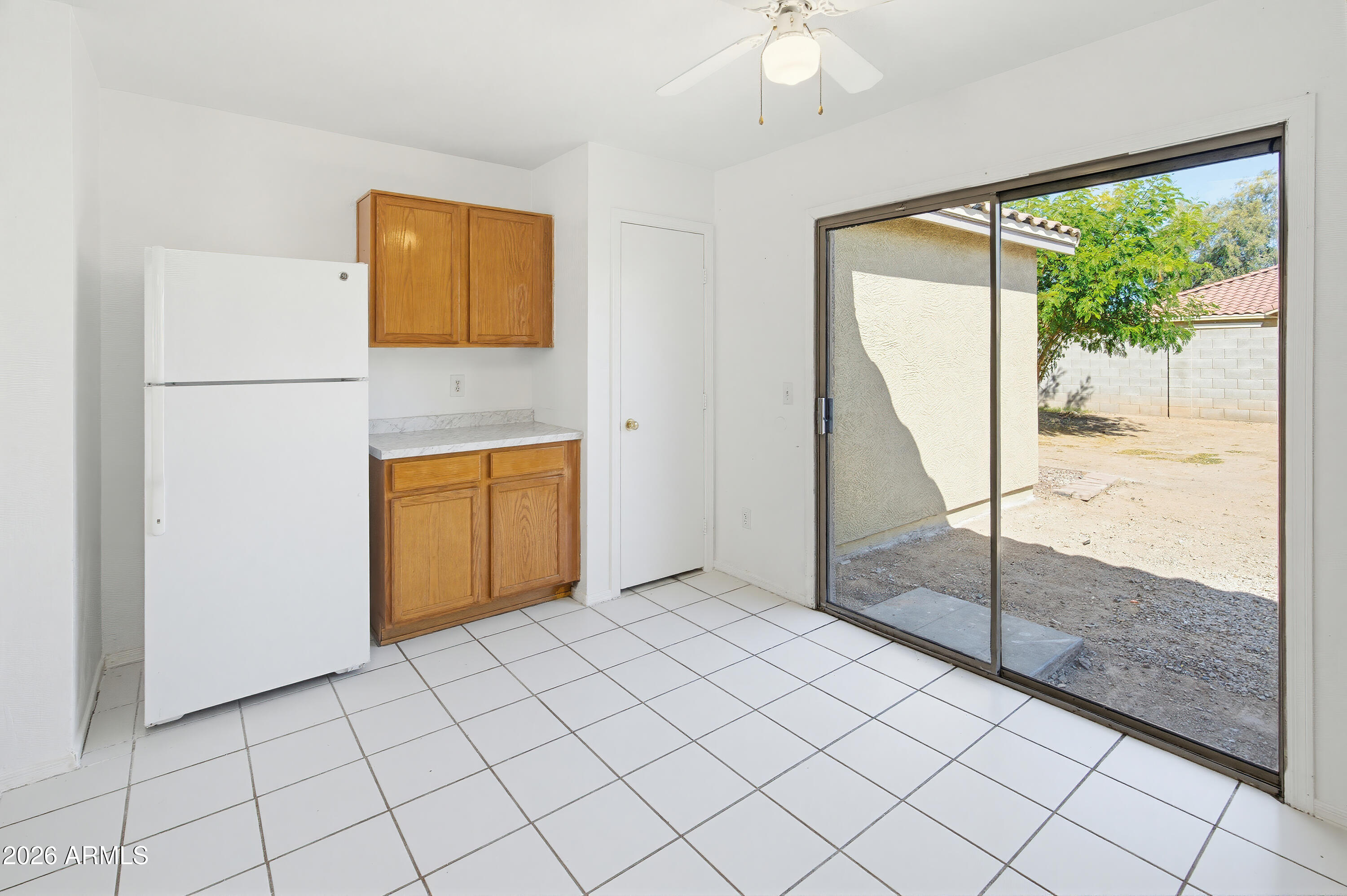 2534 West Roeser Road Phoenix, AZ 85041 - Photo 6 of 23 Kitchen view into backyard
