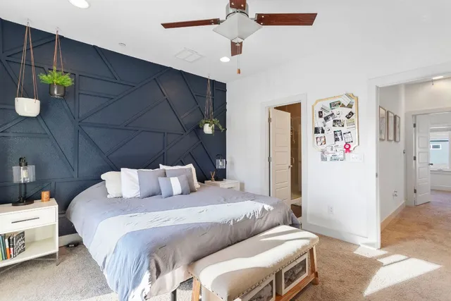 a bedroom with a bed and a cabinets