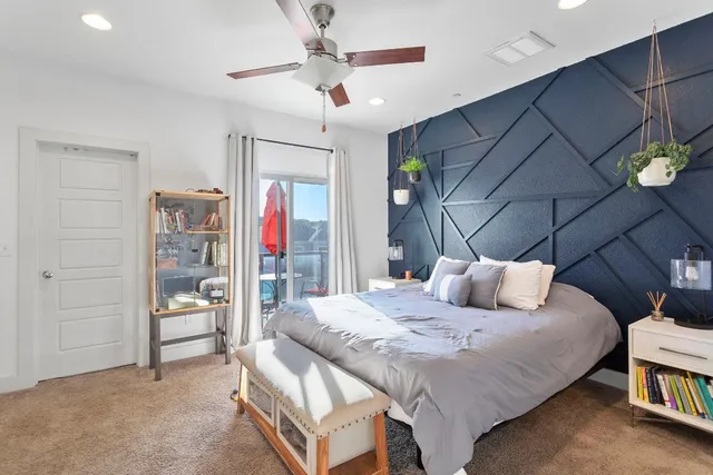 a bedroom with a bed and a cabinets