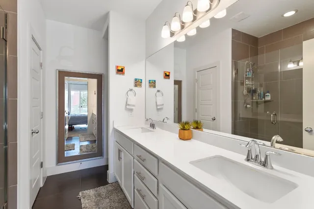 a bathroom with a sink a vanity and a mirror