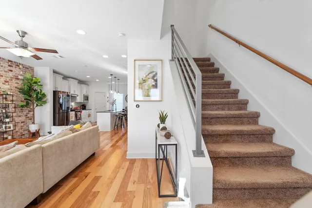 a view of a living room and kitchen floor