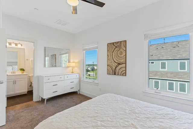 a bed room with a bed and a window