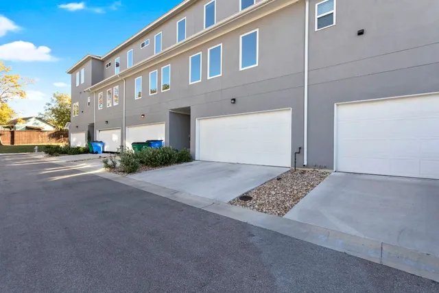 a front view of a building with a road