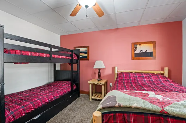 a bedroom with double bed and a window