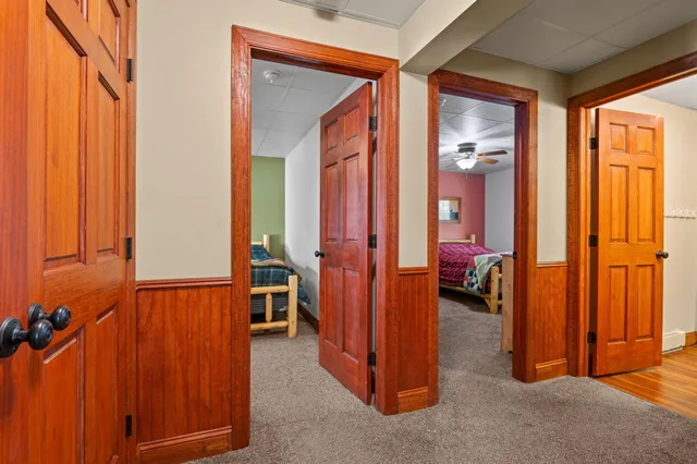a bathroom with a granite countertop sink vanity mirror and toilet