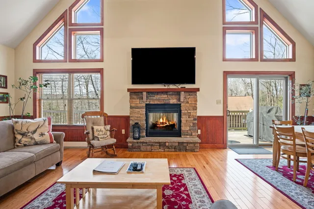 a view of a dining room with furniture and chandelier