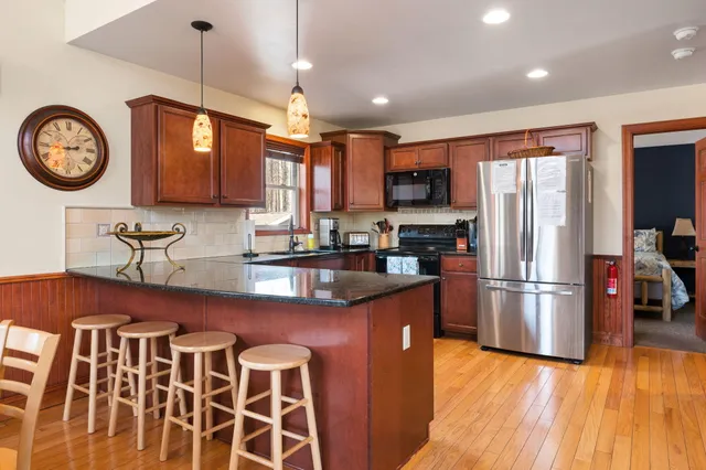 a kitchen with a sink cabinets and window