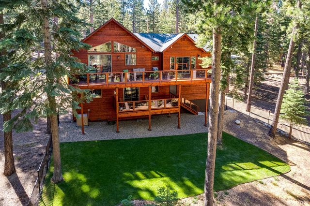 a view of a house with a yard porch and sitting area