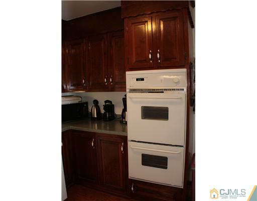 337 East Greystone Road Old Bridge, NJ 08857 - Photo 5 of 22 a kitchen with a stove and a refrigerator