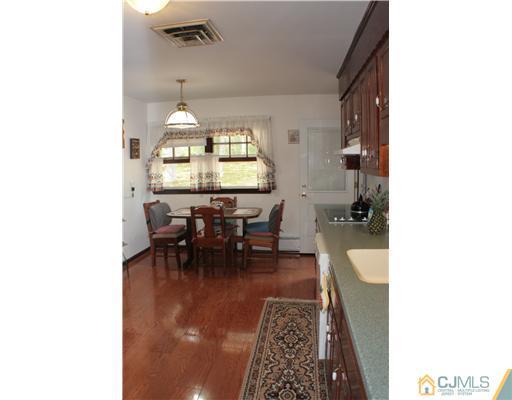 337 East Greystone Road Old Bridge, NJ 08857 - Photo 6 of 22 a living room with furniture and a chandelier