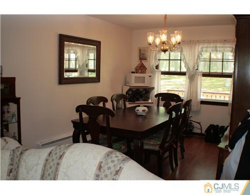 337 East Greystone Road Old Bridge, NJ 08857 - Photo 8 of 22 a view of a dining room with furniture and chandelier