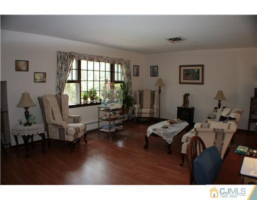 337 East Greystone Road Old Bridge, NJ 08857 - Photo 9 of 22 a living room with furniture and a large window