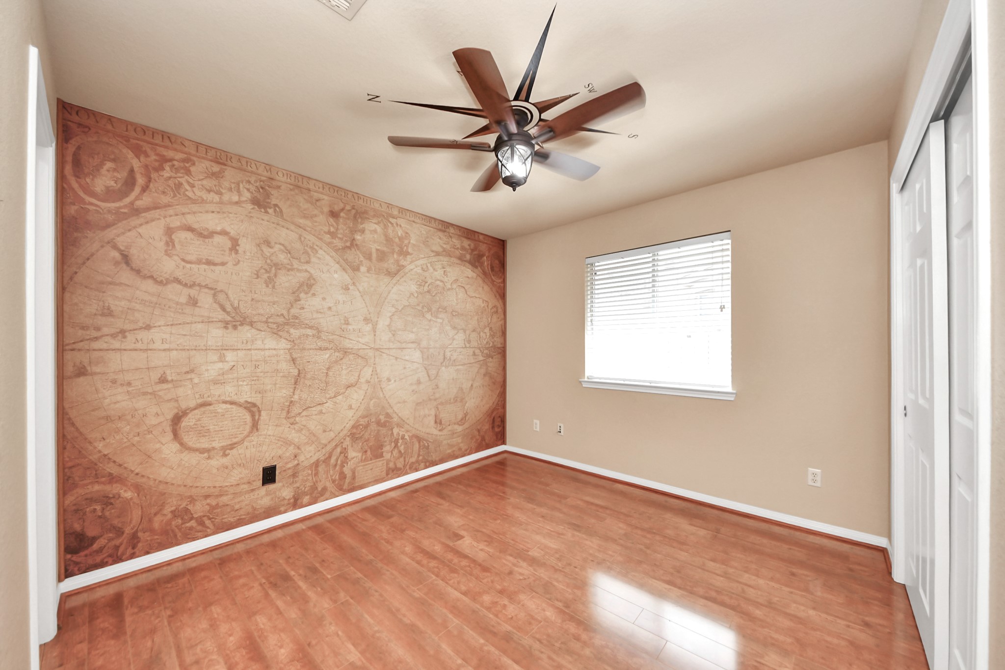 19123 Center Park Drive Spring, TX 77373 - Photo 11 of 42 a view of a livingroom with a ceiling fan and wooden floor