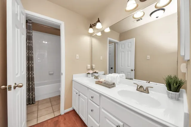 a bathroom with a sink a vanity and a mirror