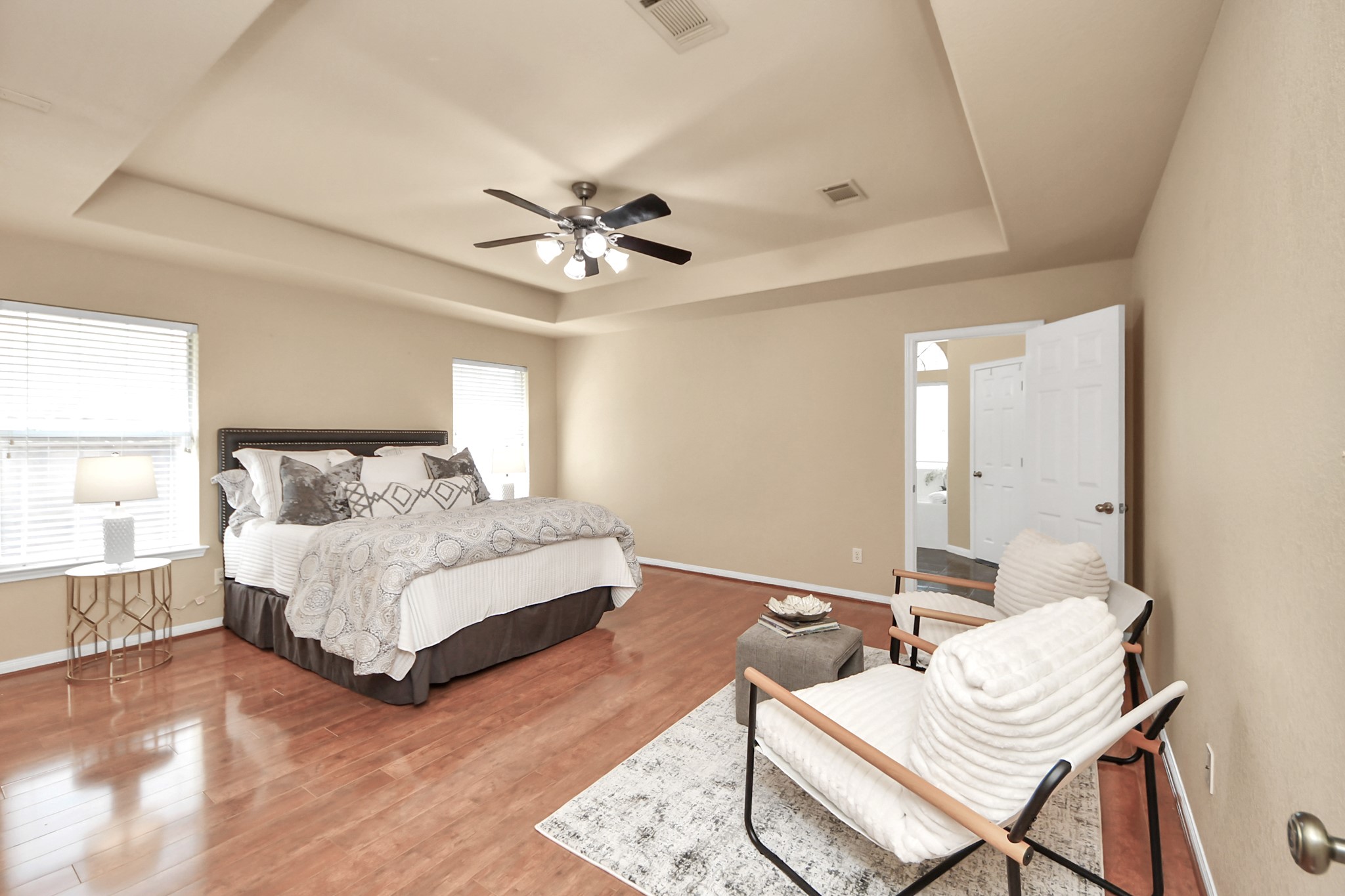 19123 Center Park Drive Spring, TX 77373 - Photo 22 of 42 a spacious bedroom with a bed and a chandelier