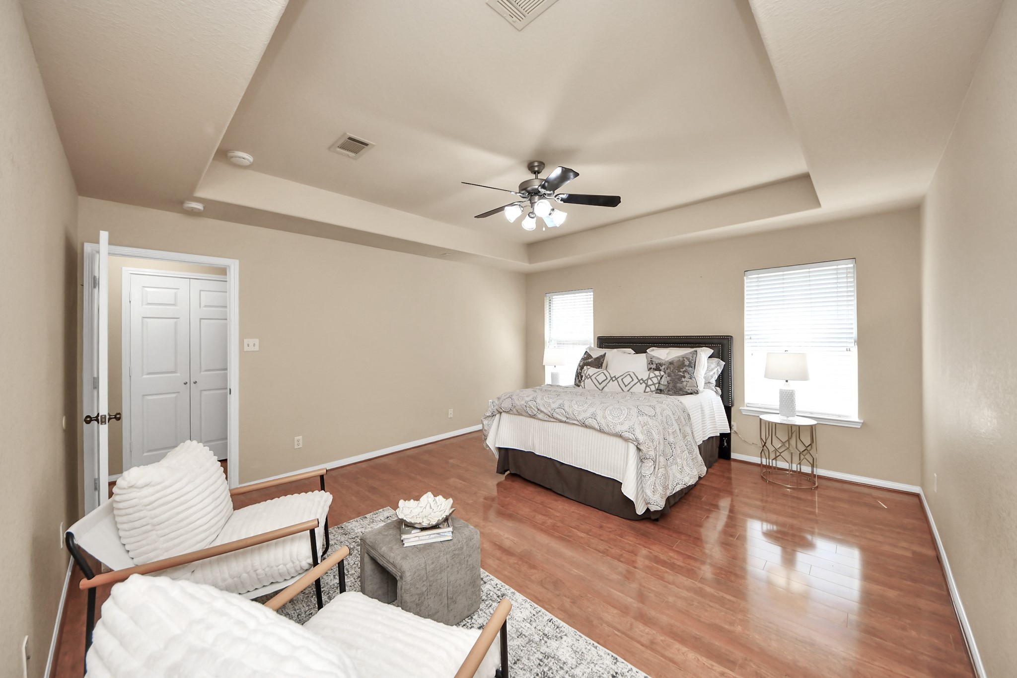 19123 Center Park Drive Spring, TX 77373 - Photo 23 of 42 a spacious bedroom with a bed and a chandelier