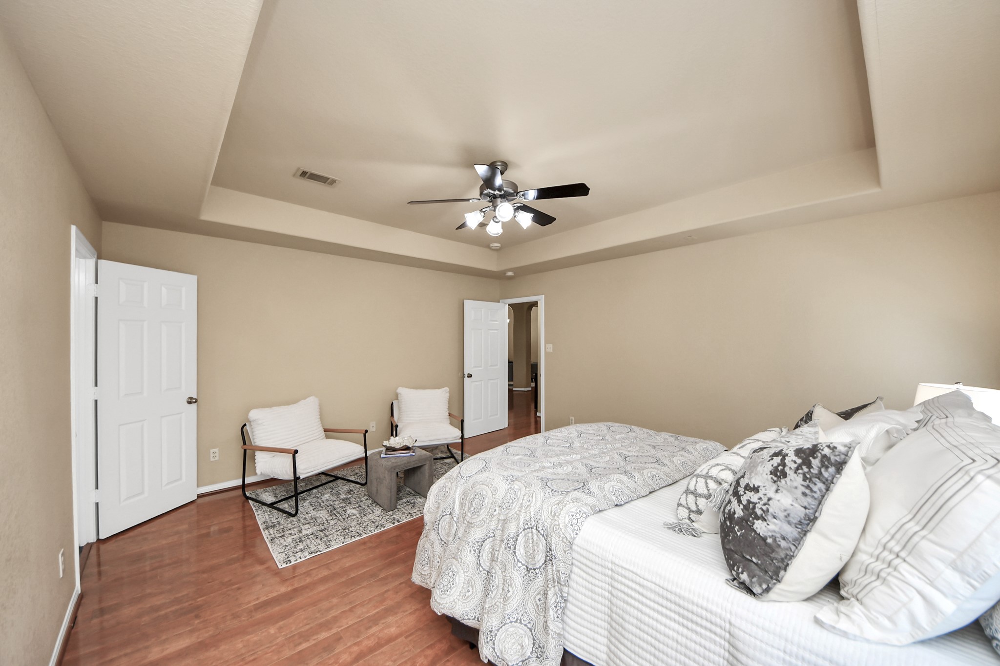 19123 Center Park Drive Spring, TX 77373 - Photo 24 of 42 a bedroom with a bed and a chandelier