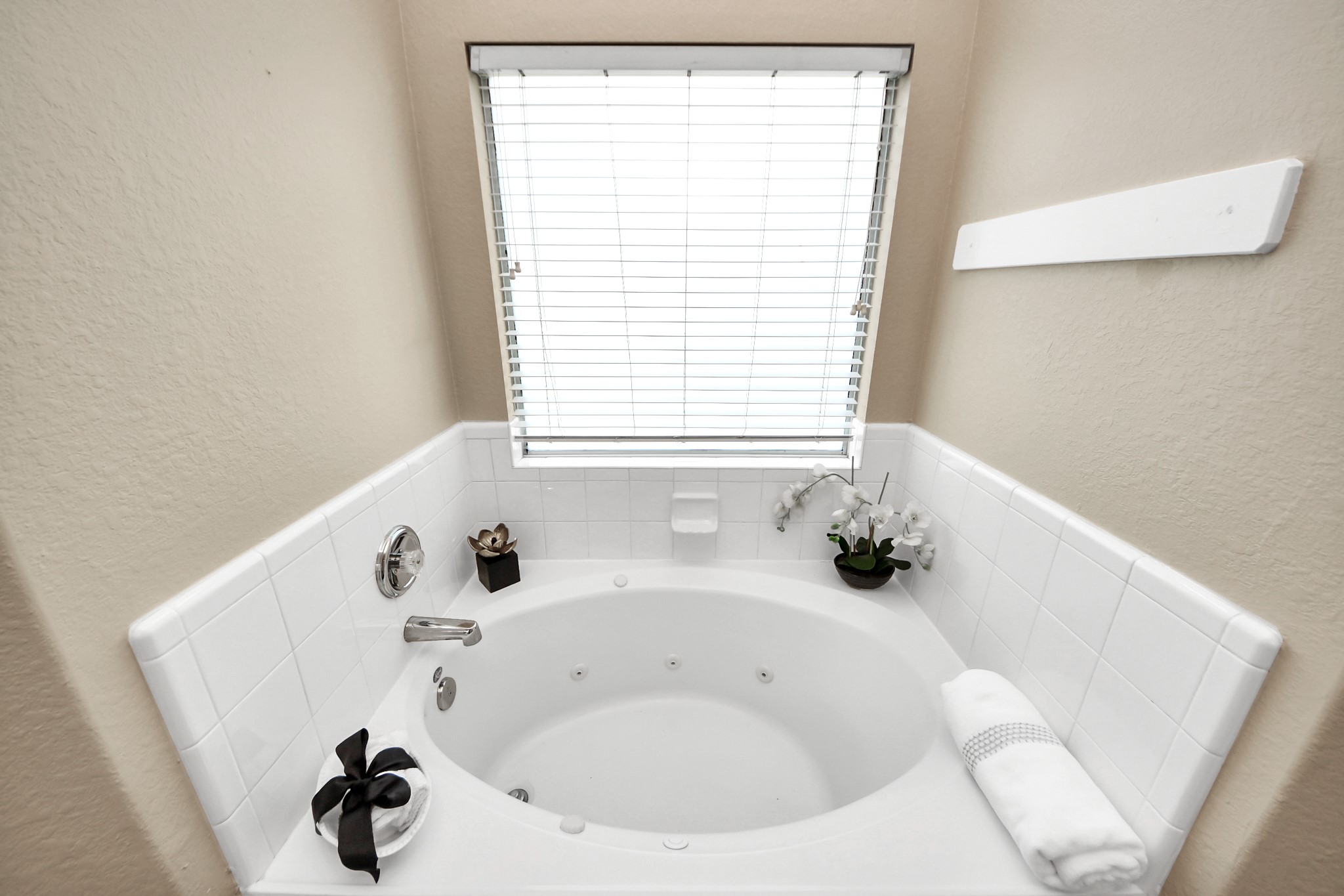 19123 Center Park Drive Spring, TX 77373 - Photo 27 of 42 a white bath tub sitting in a bathroom next to a window