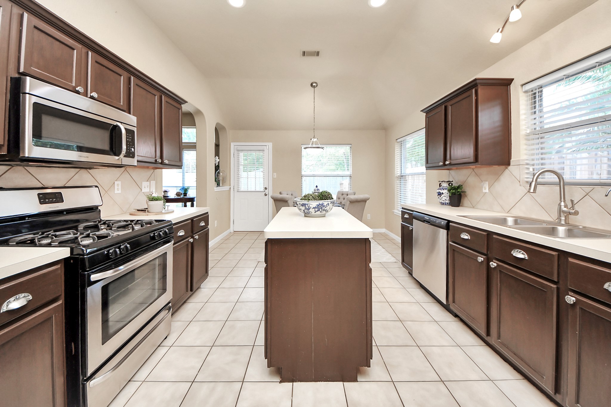 19123 Center Park Drive Spring, TX 77373 - Photo 36 of 42 a kitchen with stainless steel appliances a sink stove and microwave