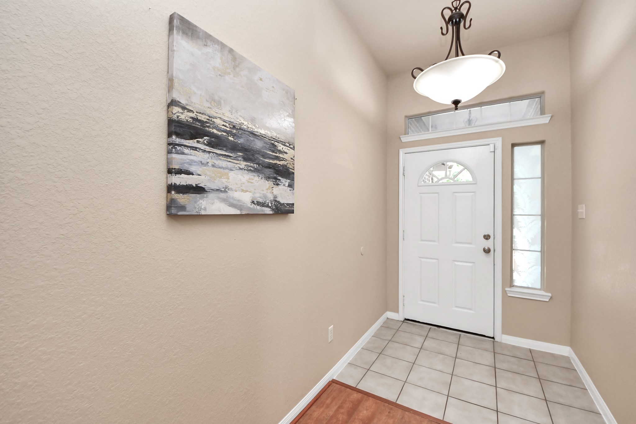 19123 Center Park Drive Spring, TX 77373 - Photo 8 of 42 a view of a hallway with a chandelier