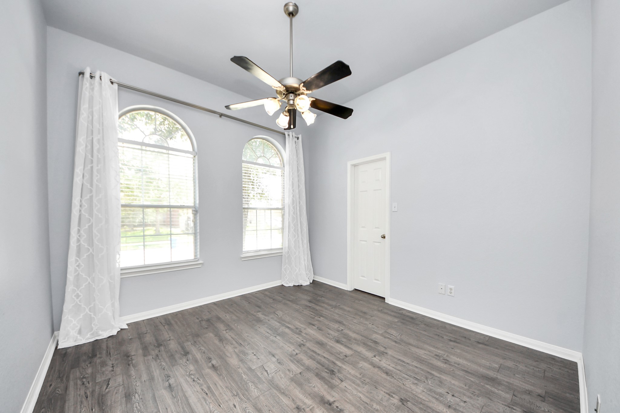 19123 Center Park Drive Spring, TX 77373 - Photo 9 of 42 a view of an empty room with chandelier fan and a window