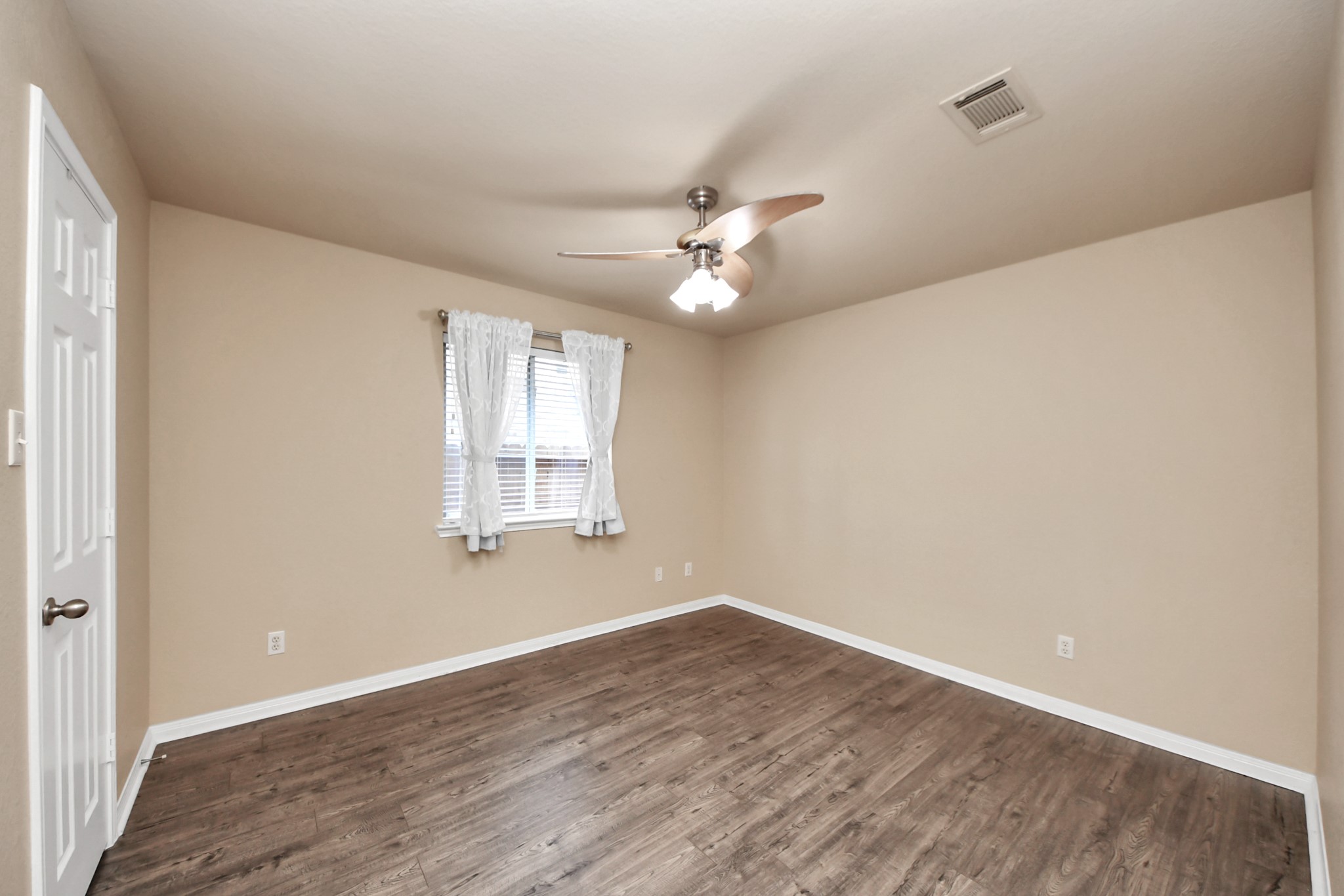 19123 Center Park Drive Spring, TX 77373 - Photo 10 of 42 wooden floor in an empty room with a window