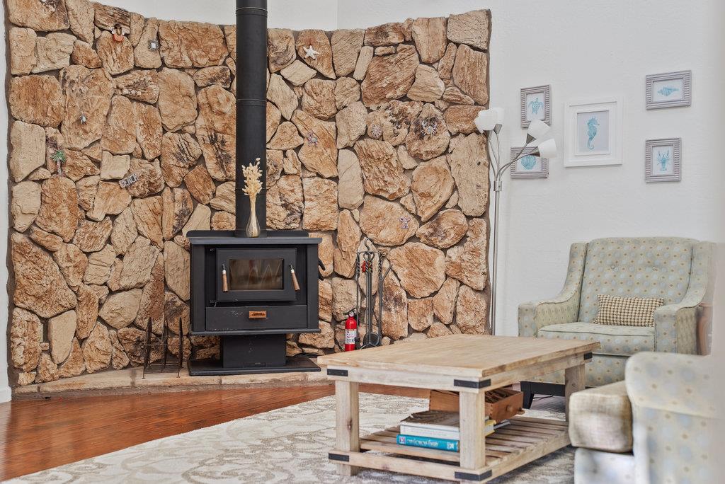 60 Robak Drive La Selva Beach, CA 95076 - Photo 13 of 44 a living room with a table and a fireplace