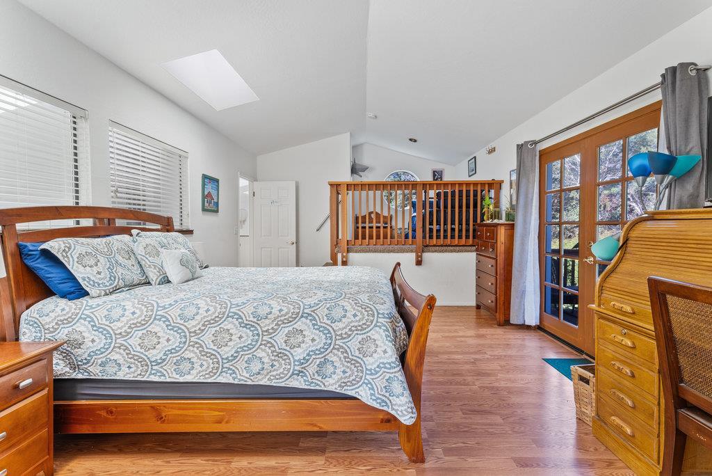 60 Robak Drive La Selva Beach, CA 95076 - Photo 15 of 44 a bedroom with a bed a dresser and chair