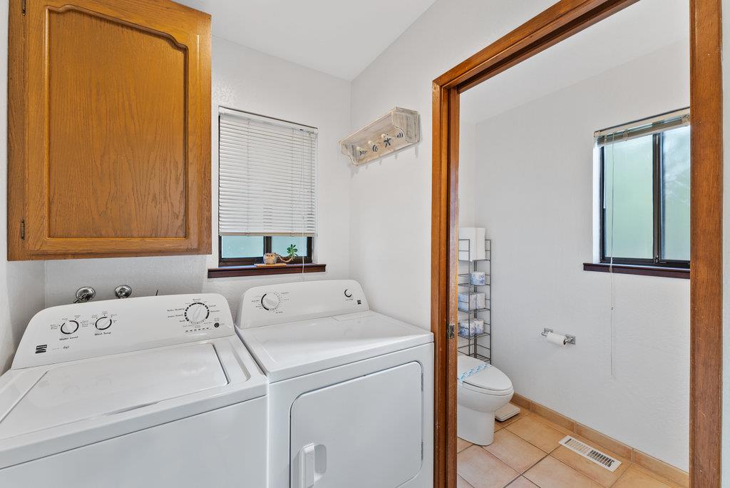 60 Robak Drive La Selva Beach, CA 95076 - Photo 29 of 44 a bathroom with a sink and a washer dryer