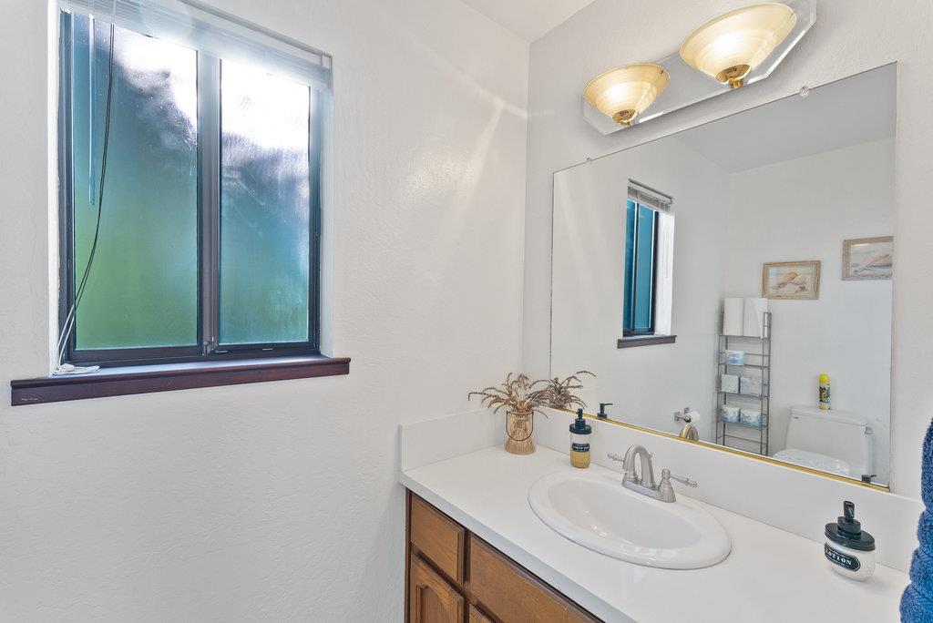 60 Robak Drive La Selva Beach, CA 95076 - Photo 30 of 44 a bathroom with a sink and a mirror