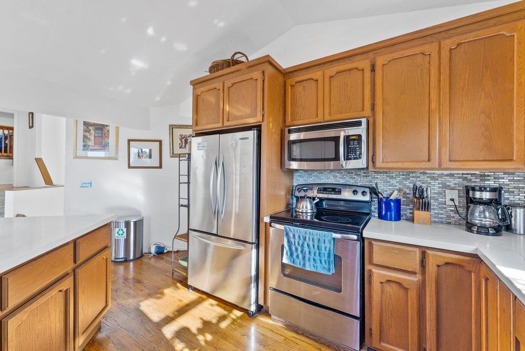 60 Robak Drive La Selva Beach, CA 95076 - Photo 9 of 44 a kitchen with stainless steel appliances granite countertop a refrigerator and a stove top oven