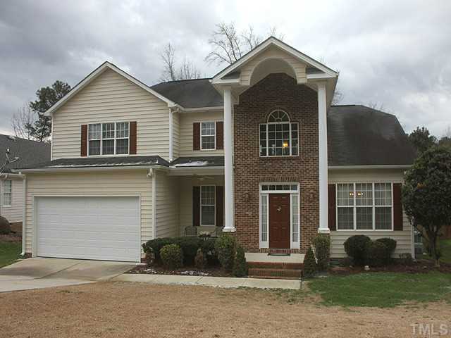 3805 Evander Way Raleigh, NC 27613 - Photo 1 of 23 Low maintenance home with grand front porch with sitting area beside garage.