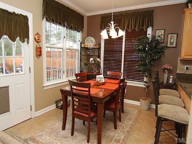 3805 Evander Way Raleigh, NC 27613 - Photo 6 of 23 The breakfast room is light filled overlooking the deck.