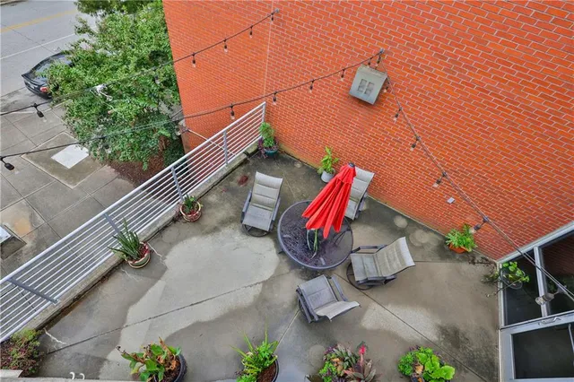 a view of a patio with a chairs and table