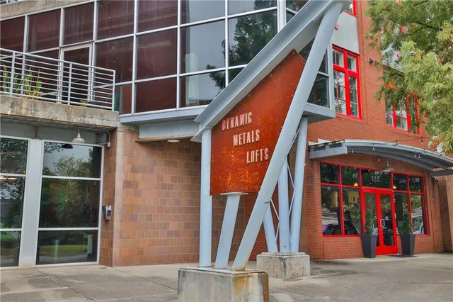a dining room with furniture and a chandelier