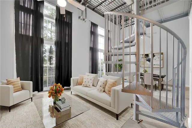 a view of a livingroom with furniture and window
