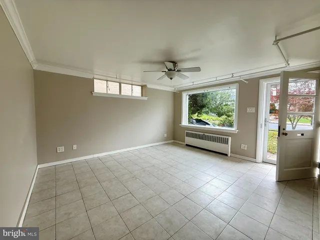 a view of a livingroom with furniture and windows