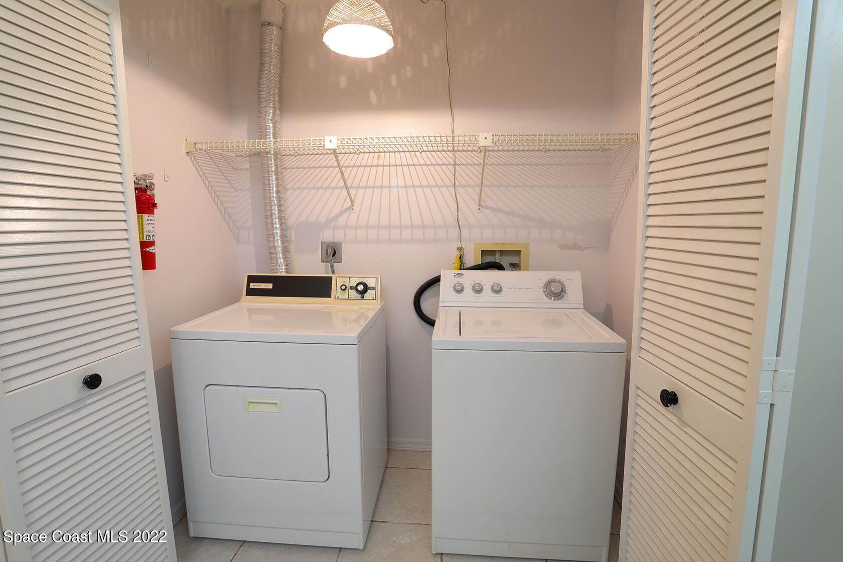1943 Quail Ridge Court, Unit 604 Cocoa, FL 32926 - Photo 15 of 38 a utility room with dryer and washer