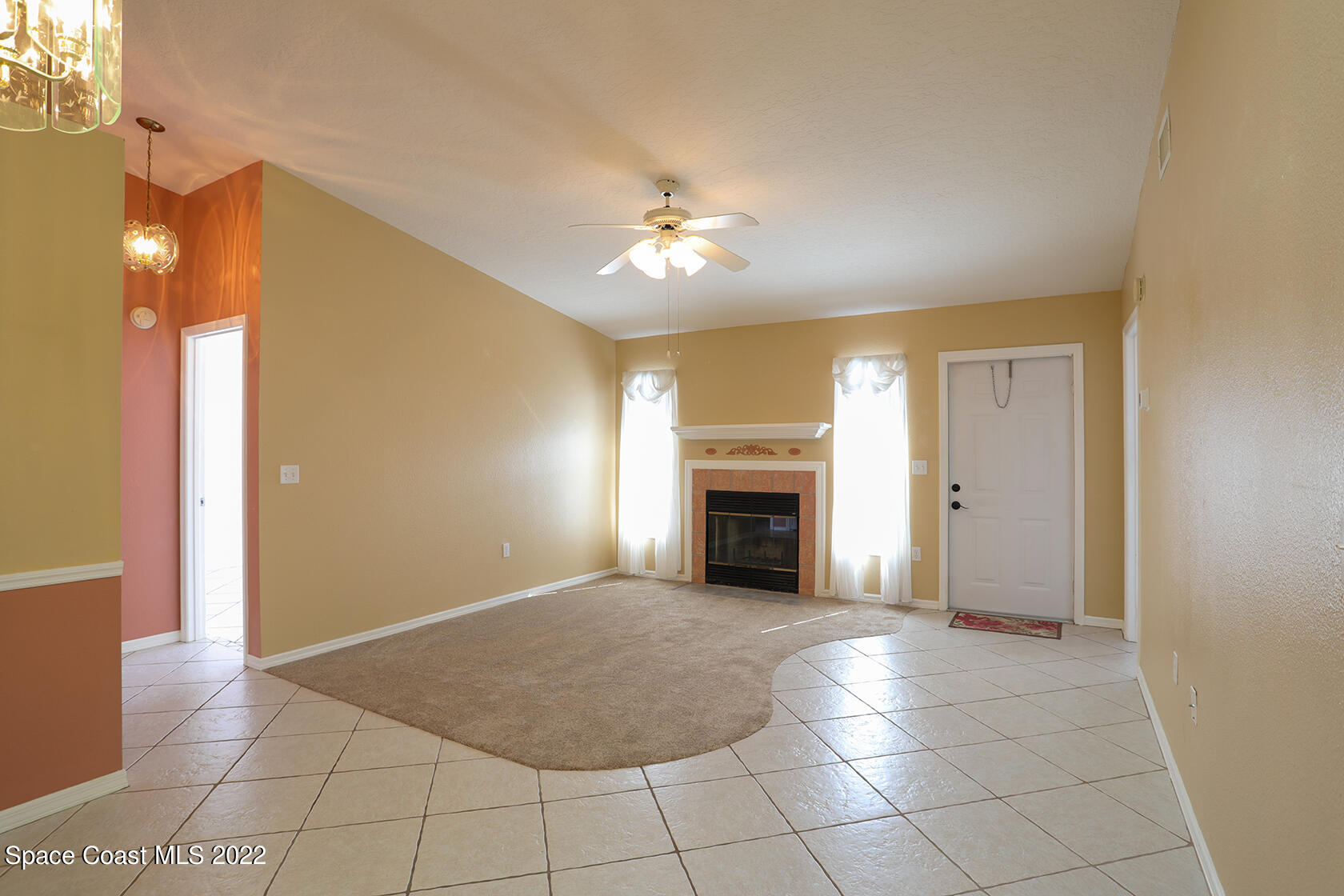 1943 Quail Ridge Court, Unit 604 Cocoa, FL 32926 - Photo 17 of 38 a view of an empty room with a fireplace