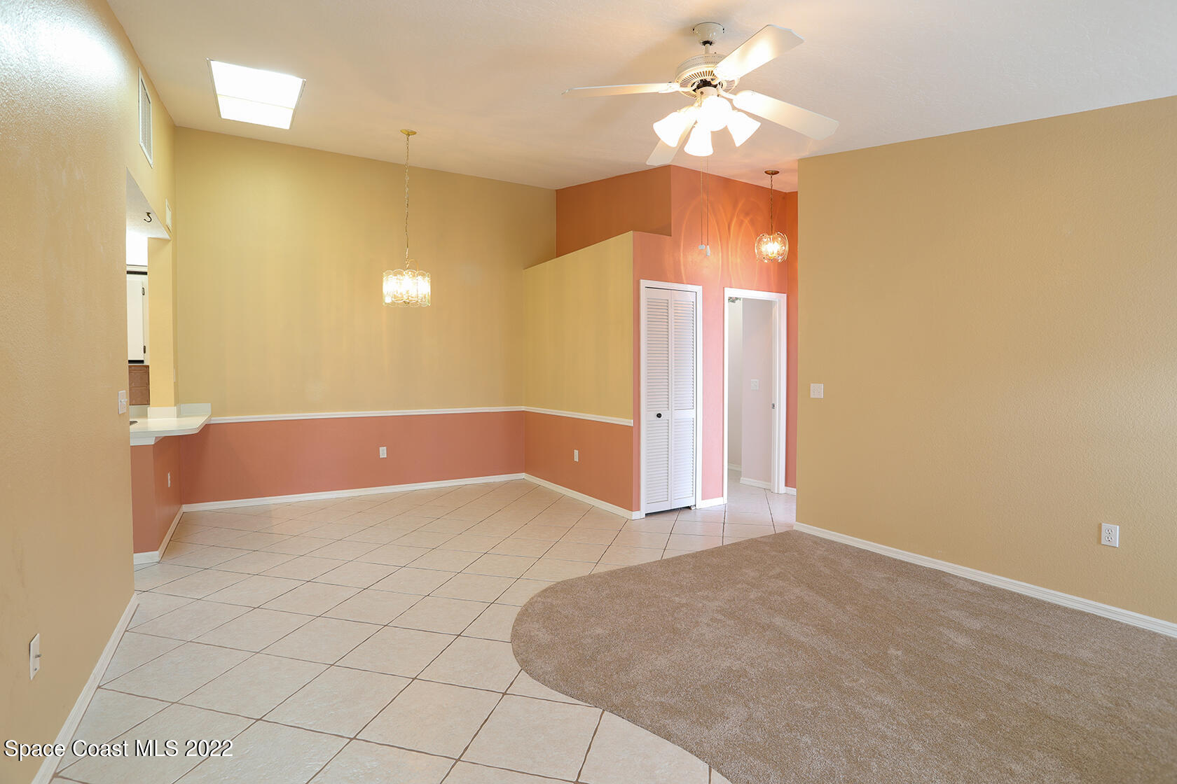 1943 Quail Ridge Court, Unit 604 Cocoa, FL 32926 - Photo 20 of 38 a view of a room with a ceiling fan and chandelier fan