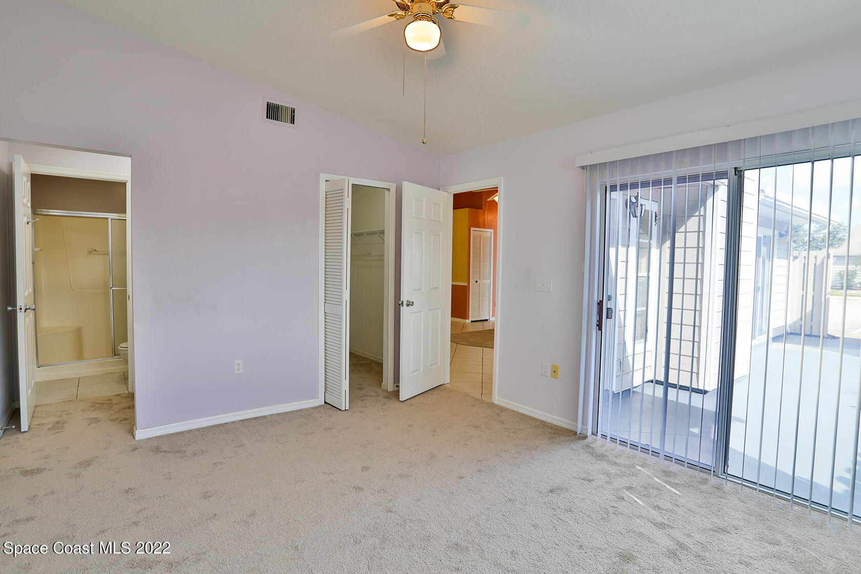 1943 Quail Ridge Court, Unit 604 Cocoa, FL 32926 - Photo 21 of 38 an empty room with windows and closet