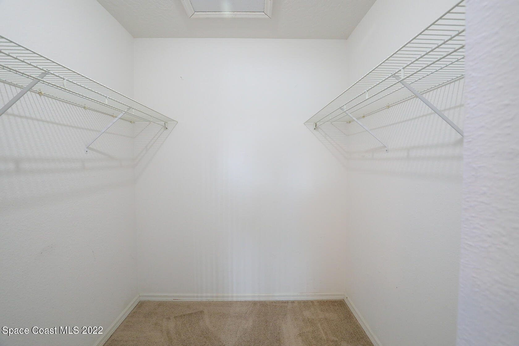1943 Quail Ridge Court, Unit 604 Cocoa, FL 32926 - Photo 23 of 38 a view of small space with racks on the wall