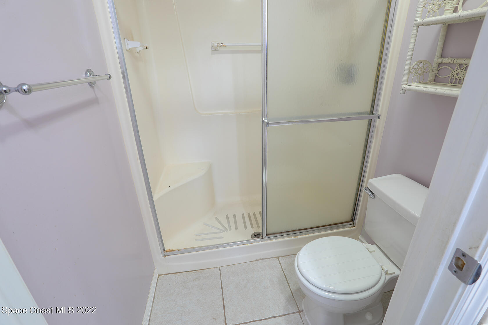 1943 Quail Ridge Court, Unit 604 Cocoa, FL 32926 - Photo 26 of 38 a bathroom with a toilet and a shower