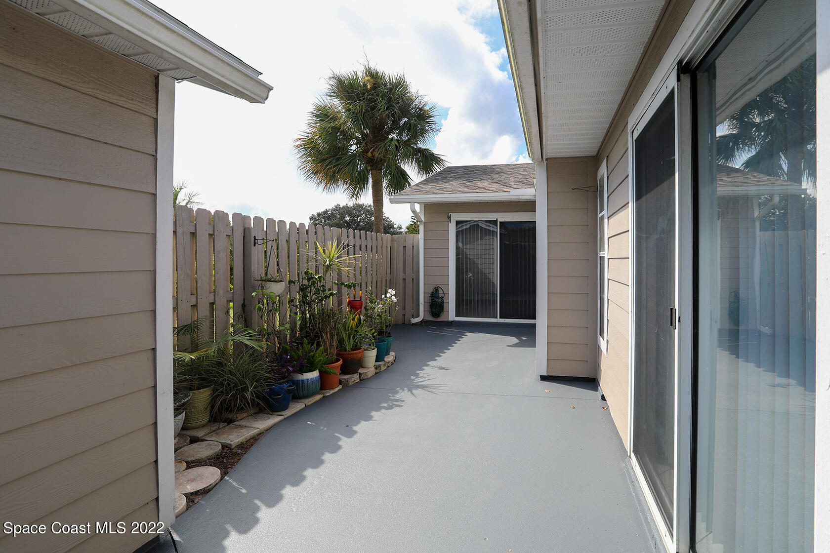 1943 Quail Ridge Court, Unit 604 Cocoa, FL 32926 - Photo 3 of 38 a view of a potted plants next to a window